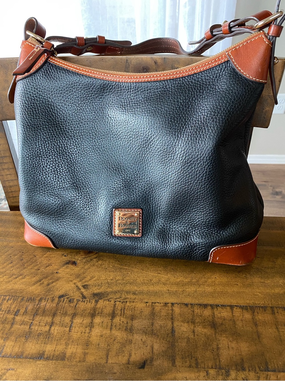 Dooney & Bourke Black Pebbled Leather Hobo with Brown Trim and Gold Hardware